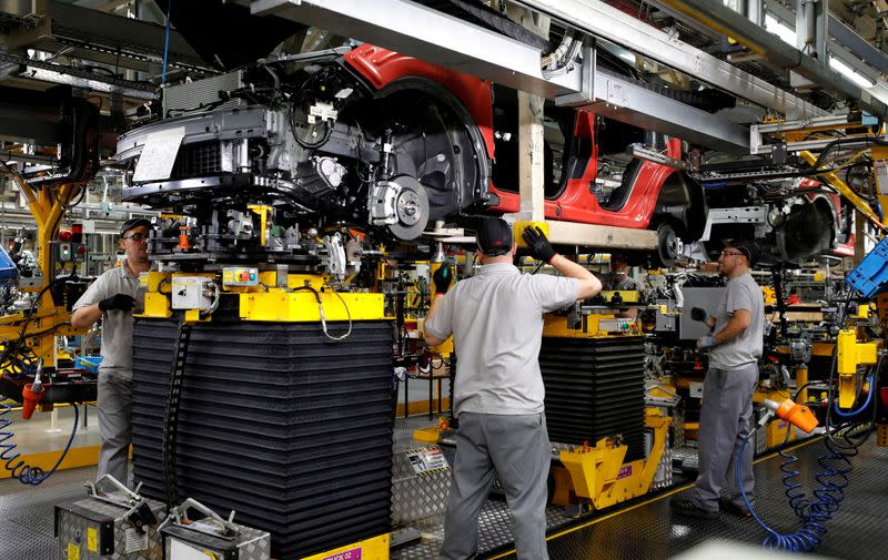 FILE PHOTO: Workers are seen on the production line at Nissan's car plant in Sunderland, Britain