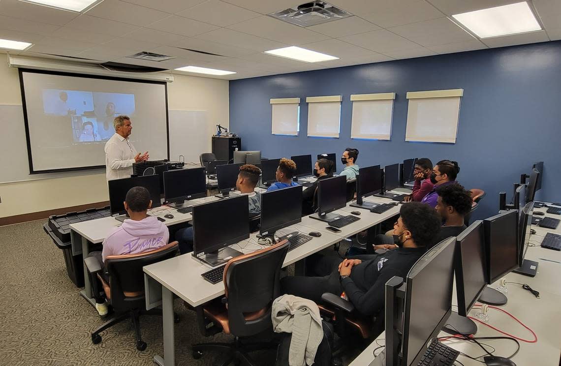 Instructor Michael Rendler teaches infrastructure interoperability to students at the Lincoln University Extension Impact Center in Kansas City. Rendler’s class is part of a larger initiative by the nonprofit group aSTEAM Village to encourage participation in the digital economy among underserved communities.