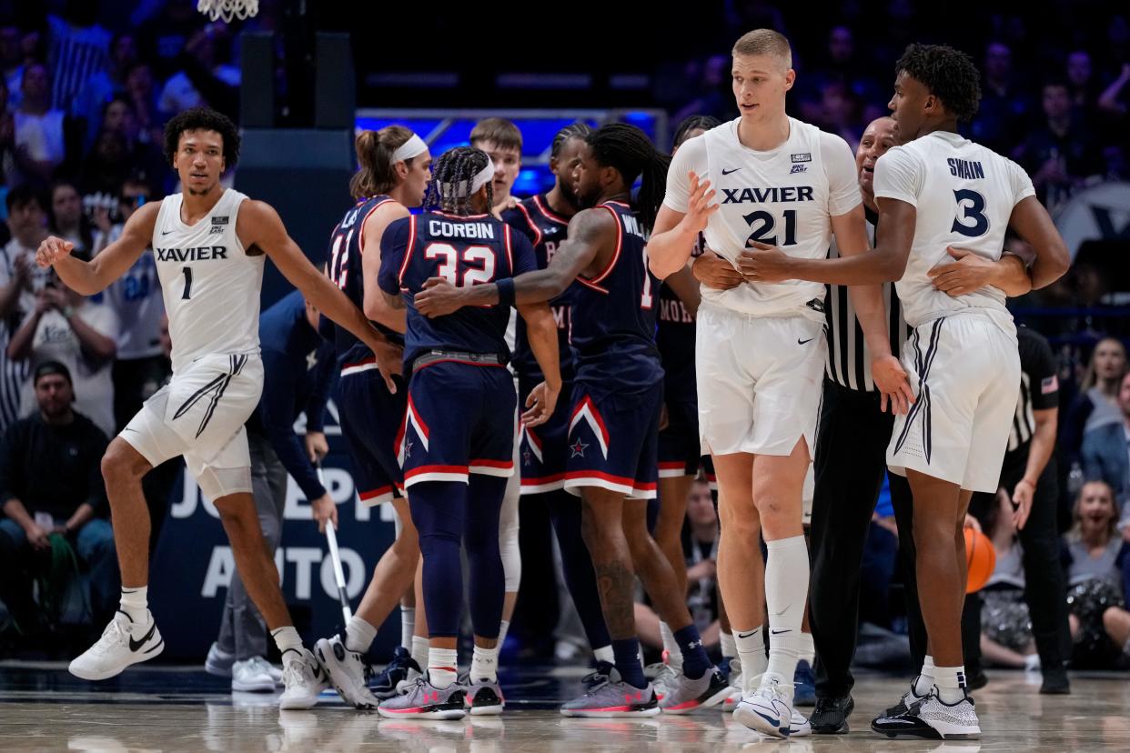 A light tussle over a jump ball is broken up in the second half of the NCAA Men’s basketball game between the Xavier Musketeers and the Robert Morris Colonials at the Cintas Center in Cincinnati on Monday, Nov. 6, 2023. Xavier won 77-63.