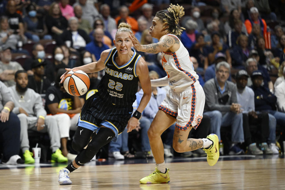 Chicago Sky guard Courtney Vandersloot drives to the basket as Connecticut Sun guard Natisha Hiedeman, right, defends during Game 4 of a WNBA basketball playoff semifinal Tuesday, Sept. 6, 2022, in Uncasville, Conn. (AP Photo/Jessica Hill)