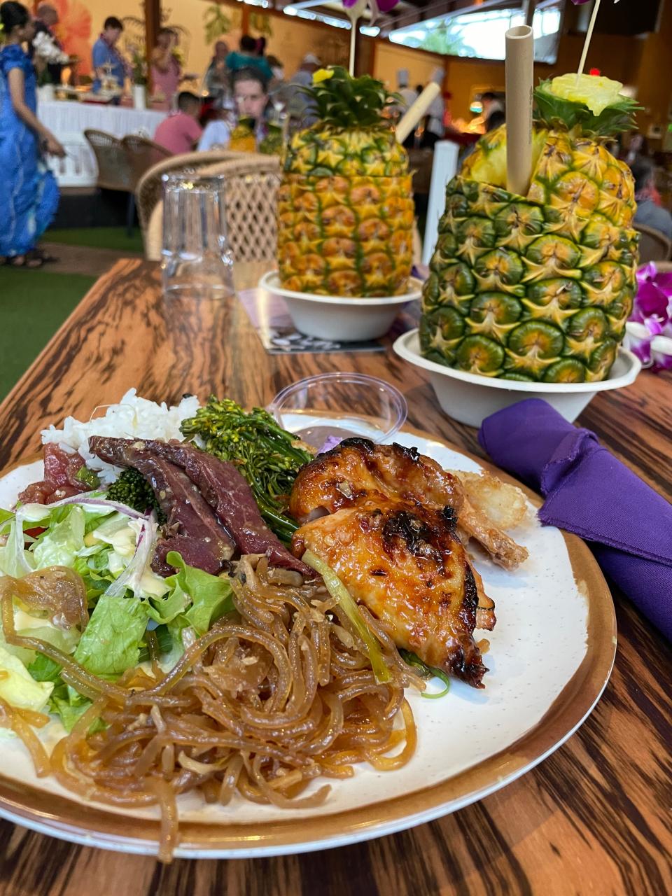 Guests can sip on a pina colada in a pineapple before hitting the buffet, which serves up local fare like chicken long rice and huli huli chicken.