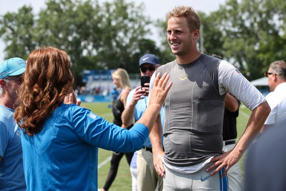 Gov. Gretchen Whitmer talks to Detroit Lions quarterback Jared Goff after the joint practice with New York Giants at Detroit Lions headquarters and training facility in Allen Park on Wednesday, August 9, 2023.