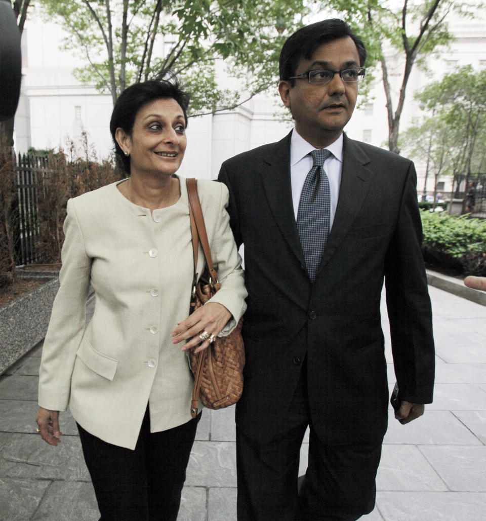 Anil Kumar, a former financial consultant-turned-government witness, and his wife, leave Federal Court in New York, Thursday, July 19, 2012. J=Kumar was sentenced Thursday to two years of probation after prosecutors credited him with helping convict a pair of Wall Street titans on insider trading charges. (AP Photo/Richard Drew)