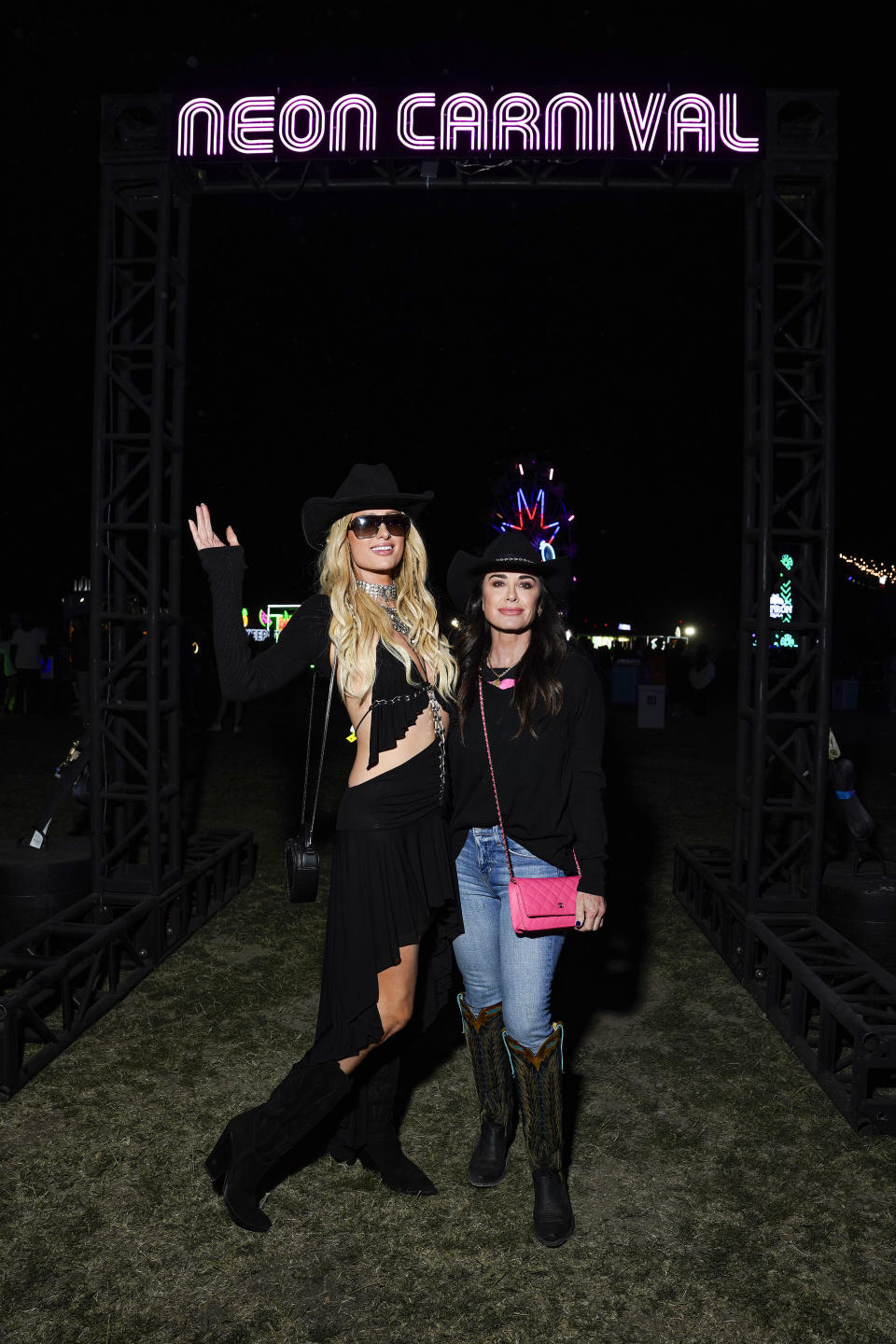 Paris Hilton and Kyle Richards attend Neon Carnival