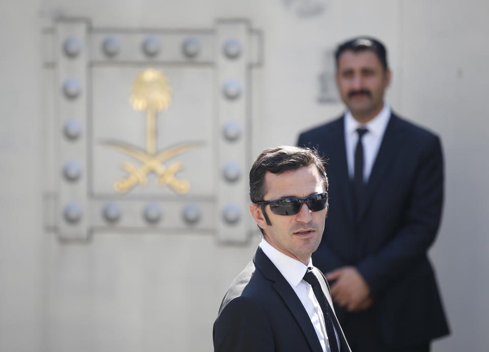 Security men guard the entrance to the Saudi Arabia consulate in Istanbul, prior to a ceremony outside, marking the one-year anniversary of the death of Saudi journalist Jamal Khashoggi, Wednesday, Oct. 2, 2019. A vigil was held outside the consulate building Wednesday, starting at 1:14 p.m. (1014 GMT) marking the time Khashoggi walked into the building. (AP Photo/Lefteris Pitarakis)