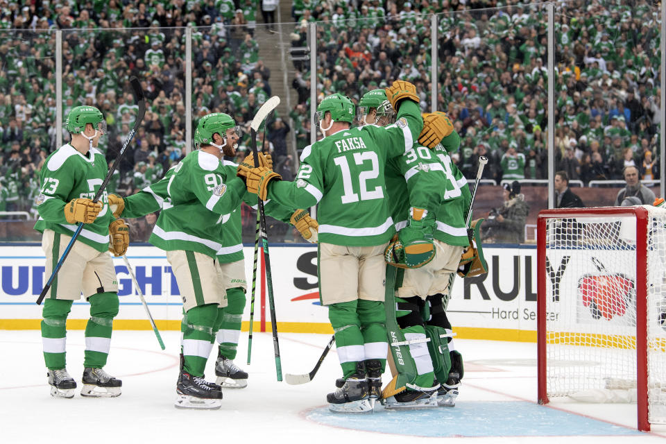 The Dallas Stars celebrate their 4-2 win over the Nashville Predators at the end of the NHL Winter Classic hockey game at the Cotton Bowl, Wednesday, Jan. 1, 2020, in Dallas. (AP Photo/Jeffrey McWhorter)