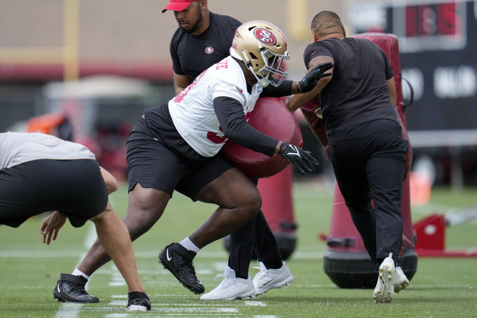 San Francisco 49ers defensive tackle Javon Hargrave, center, takes part in a drill during an NFL football practice, Wednesday, June 7, 2023, in Santa Clara, Calif. (AP Photo/Godofredo A. Vásquez)