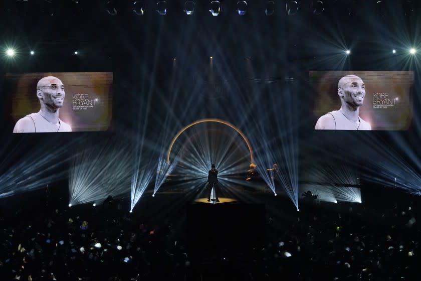 The late Kobe Bryant is honored, as are others who have died, as Ne-Yo sings "Incredible" during the 2020 Basketball Hall of Fame enshrinement ceremony Saturday, May 15, 2021, in Uncasville, Conn. (AP Photo/Kathy Willens)