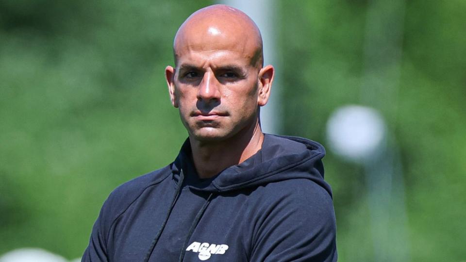 Jul 22, 2023; Florham Park, NJ, USA; New York Jets head coach Robert Saleh looks on in front of quarterback Aaron Rodgers (8) during the New York Jets Training Camp at Atlantic Health Jets Training Center.