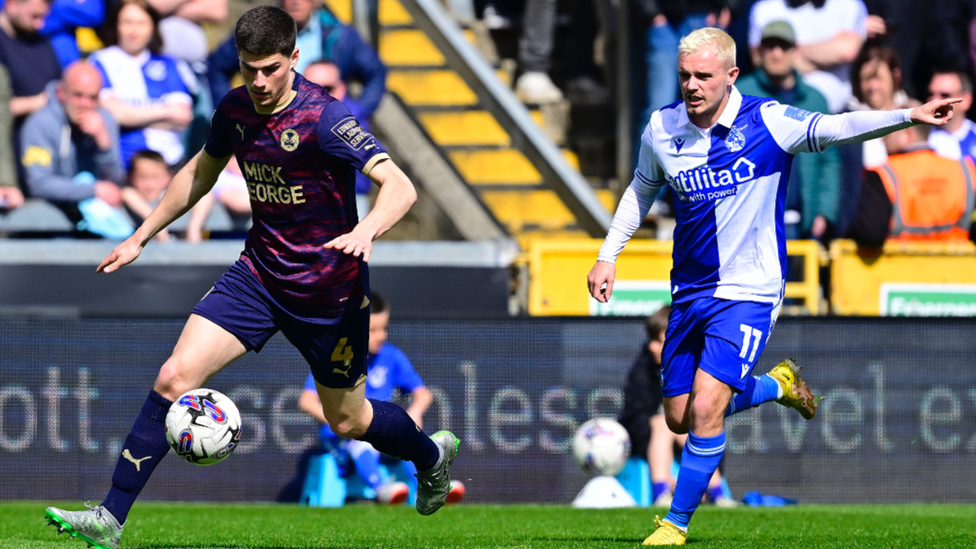 Players from Bristol Rovers and Peterborough compete for the ball at the Memorial Stadium on Saturday