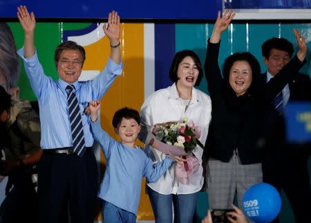 Moon Jae-in (L), the presidential candidate of the Democratic Party of Korea, his wife Kim Jung-sook (R), his daughter and grandson attend his election campaign rally in Seoul, South Korea May 8, 2017. REUTERS/Kim Kyung-Hoon
