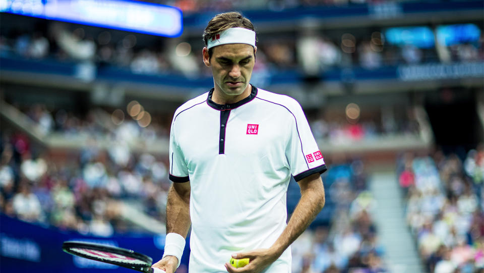 Roger Federer looking down at the court during the US Open.