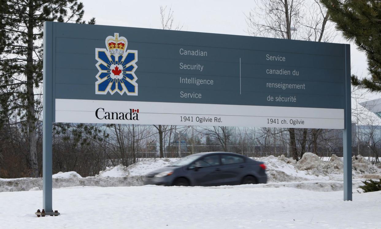 <span>A vehicle passes a sign outside the Canadian Security Intelligence Service (CSIS) headquarters in Ottawa, Ontario.</span><span>Photograph: Chris Wattie/Reuters</span>
