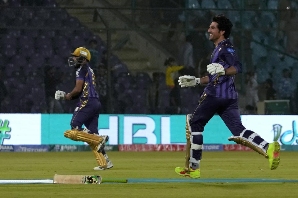 Quetta Gladiators' Mohammad Wasim, right, and Saud Shakeel celebrate after winning the the Pakistan Super League T20 cricket match against Lahore Qalandars, in Karachi, Pakistan, Sunday, March 10, 2024. (AP Photo/Fareed Khan)