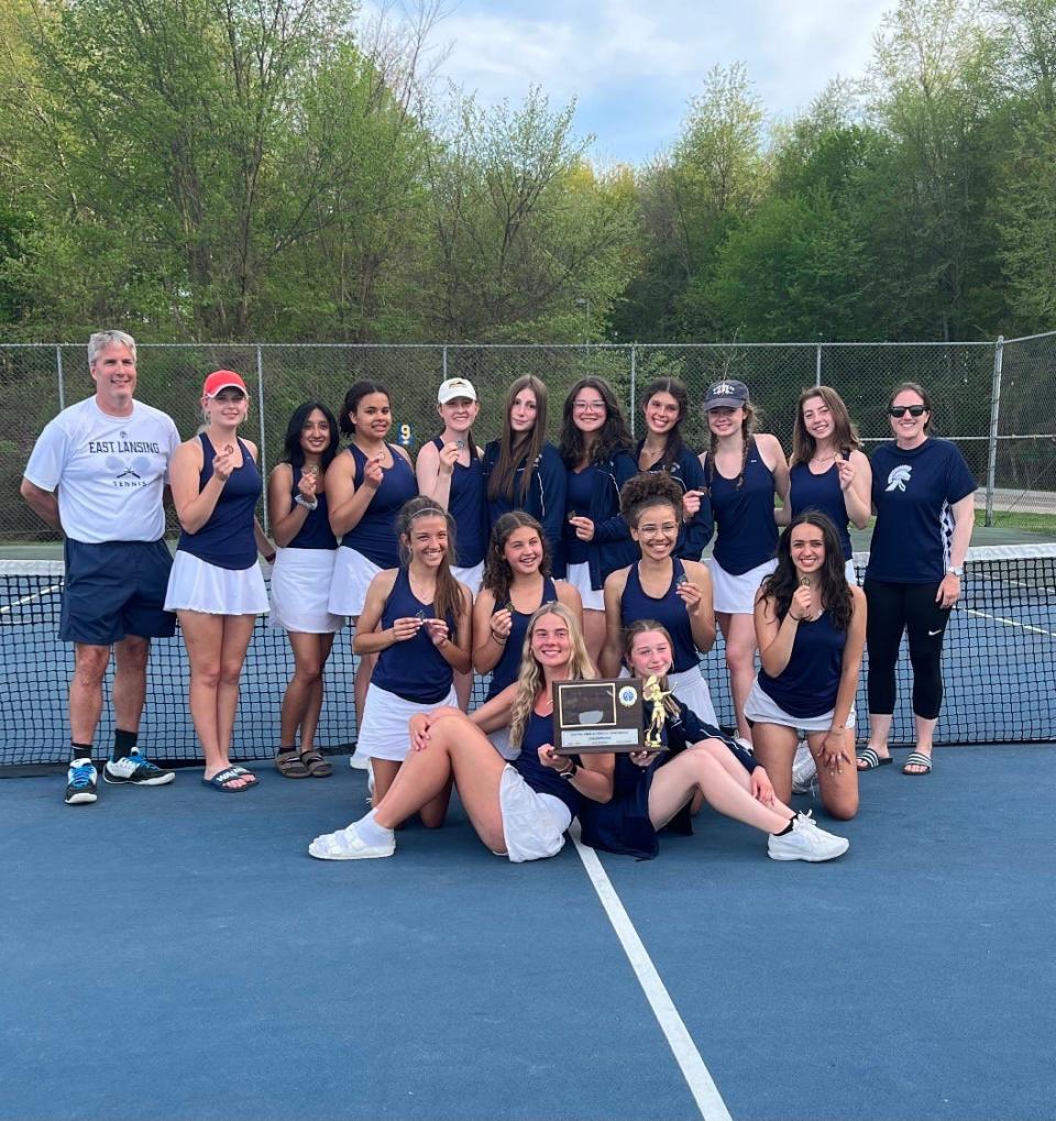 The East Lansing girls tennis team, pictured with their CAAC Blue trophy, had 24 points while finishing as a Division 2 regional runner-up at Mason.