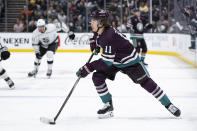 Anaheim Ducks center Trevor Zegras (11) looks to shoot the puck during the third period of an NHL hockey game against the Los Angeles Kings, Tuesday, April 9, 2024, in Anaheim, Calif. (AP Photo/William Liang)