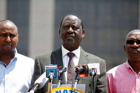 Kenyan opposition leader Raila Odinga (C), the presidential candidate of the National Super Alliance (NASA) coalition speaks during a press conference in Nairobi, Kenya September 26, 2017. REUTERS/Baz Ratner