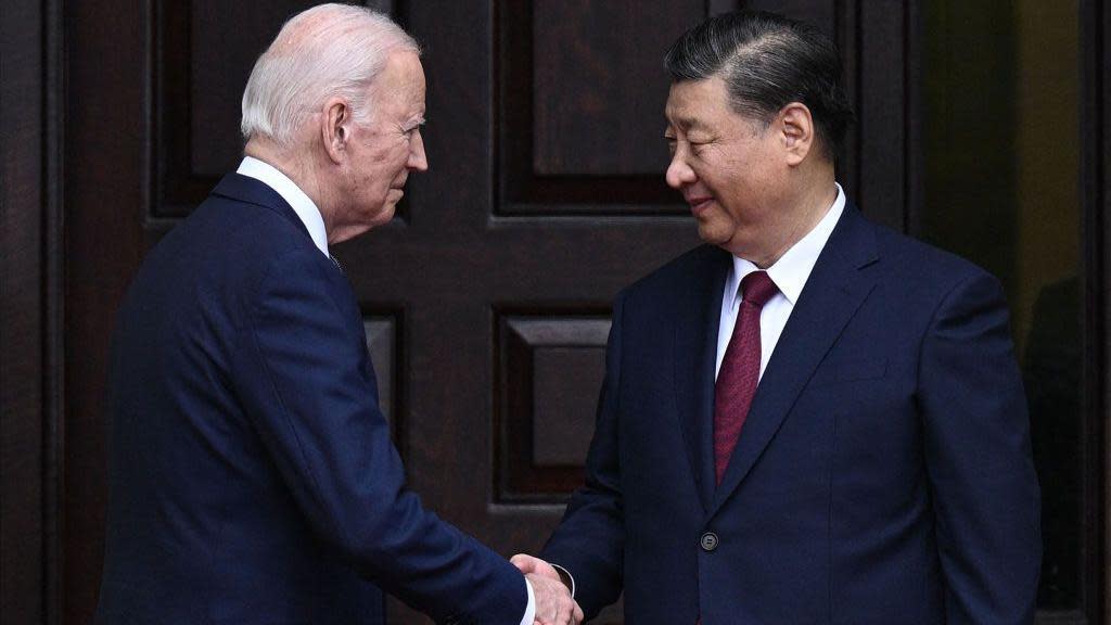 US President Joe Biden greets Chinese President Xi Jinping before a meeting during the Asia-Pacific Economic Cooperation (APEC) Leaders' week in Woodside, California on November 15, 2023