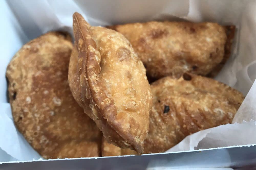 Four empanadas in a box from Empanada Mama in New York