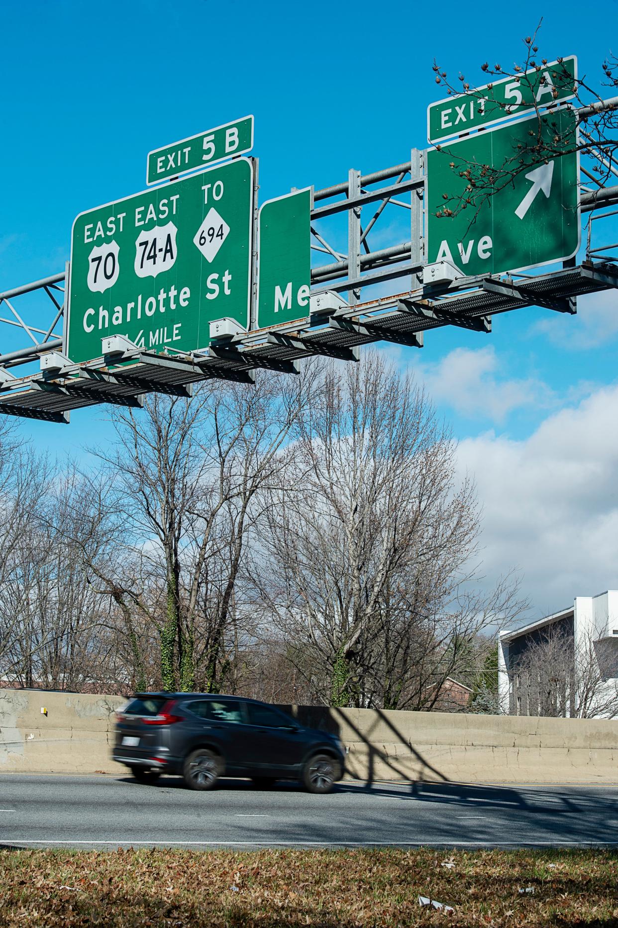 A portion of the Merrimon Avenue exit sign on I-240 was missing November 28, 2022.