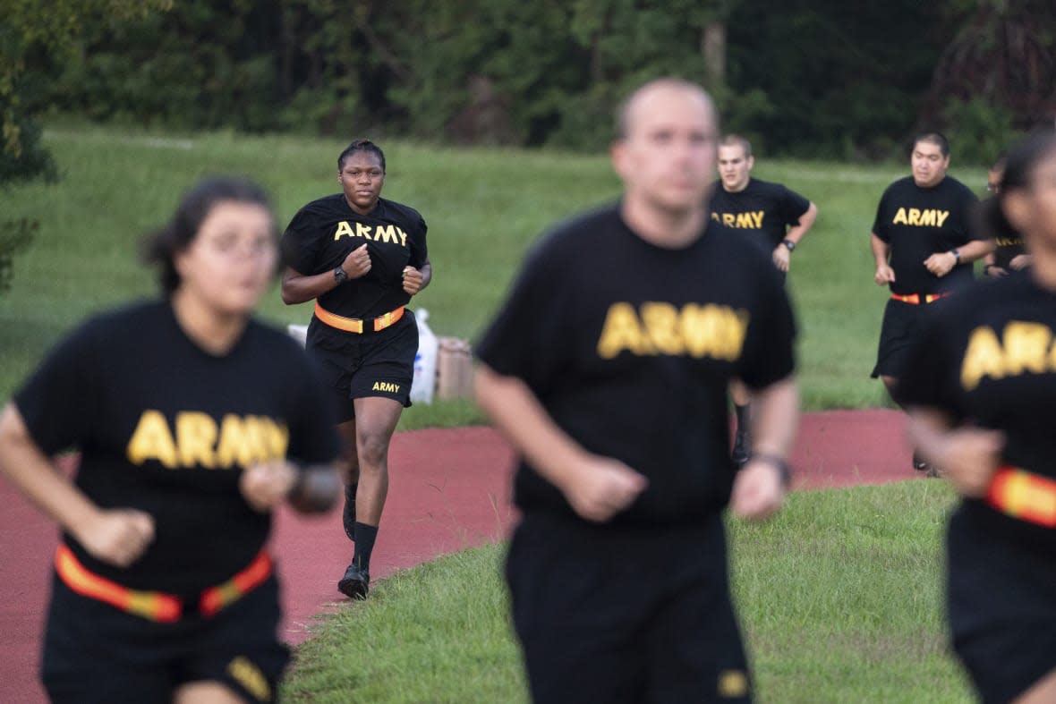 Students in the new Army prep course run around a track during physical training exercises at Fort Jackson in Columbia, S.C., Aug. 27, 2022. (AP Photo/Sean Rayford, File)