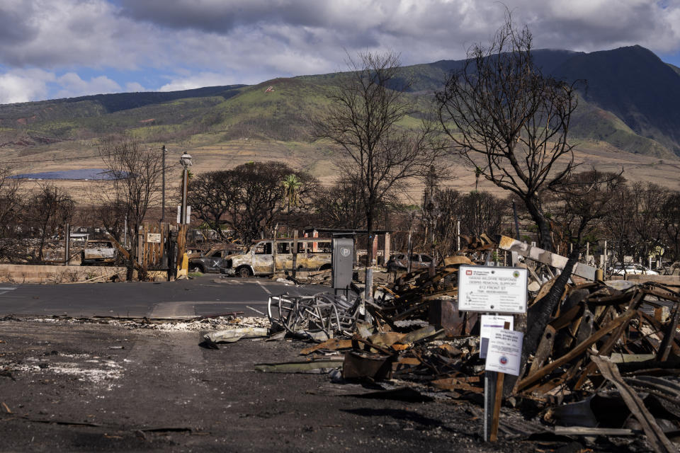 Debris of former shops and businesses on Front Street in burn zone 11A is pictured Friday, Dec. 8, 2023, in Lahaina, Hawaii. The area reopened Monday, Dec. 11, to residents and owners with entry passes. (AP Photo/Lindsey Wasson)