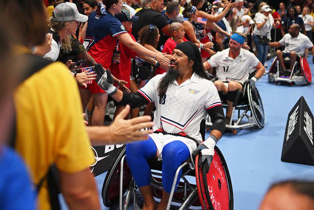 <p>Lukas Schulze/Getty</p> Garrett Kuwada of Team USA celebrates after winning in the Mixed Team Wheelchair Rugby Gold Medal match between Team United States and Team United Kingdom during day two of the Invictus Games.