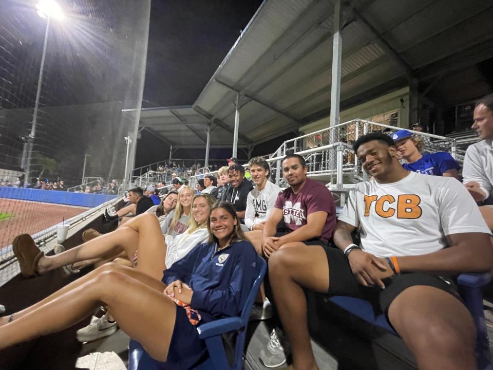 Jordan Hall (far right, white shirt), a four-star linebacker headed to Michigan State, sits with other students at IMG Academy on Feb. 22, 2022.