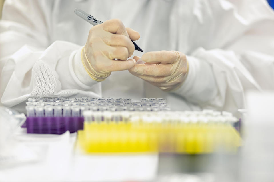 Laboratory technicians mark samples during a training at AP8 in Abbott Park, Ill.<span class="copyright">Courtesy Abbott</span>