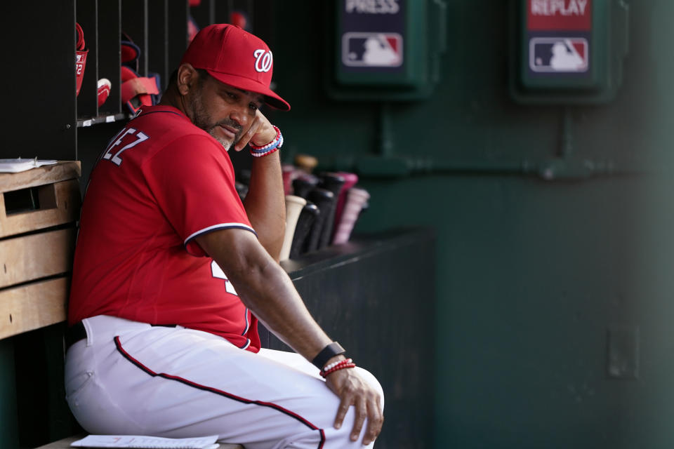 Washington Nationals manager Dave Martinez sits in the dugout in the sixth inning of the second game of a baseball doubleheader against the Seattle Mariners, Wednesday, July 13, 2022, in Washington. (AP Photo/Patrick Semansky)