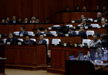 Kem Sokha (front, 3rd L), leader of the Cambodia National Rescue Party (CNRP), sits at the National Assembly during a plenary session at the National Assembly of Cambodia, in central Phnom Penh, December 7, 2016. REUTERS/Samrang Pring