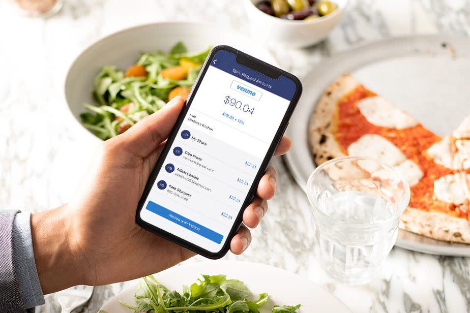 Venmo on phone screen, food on table