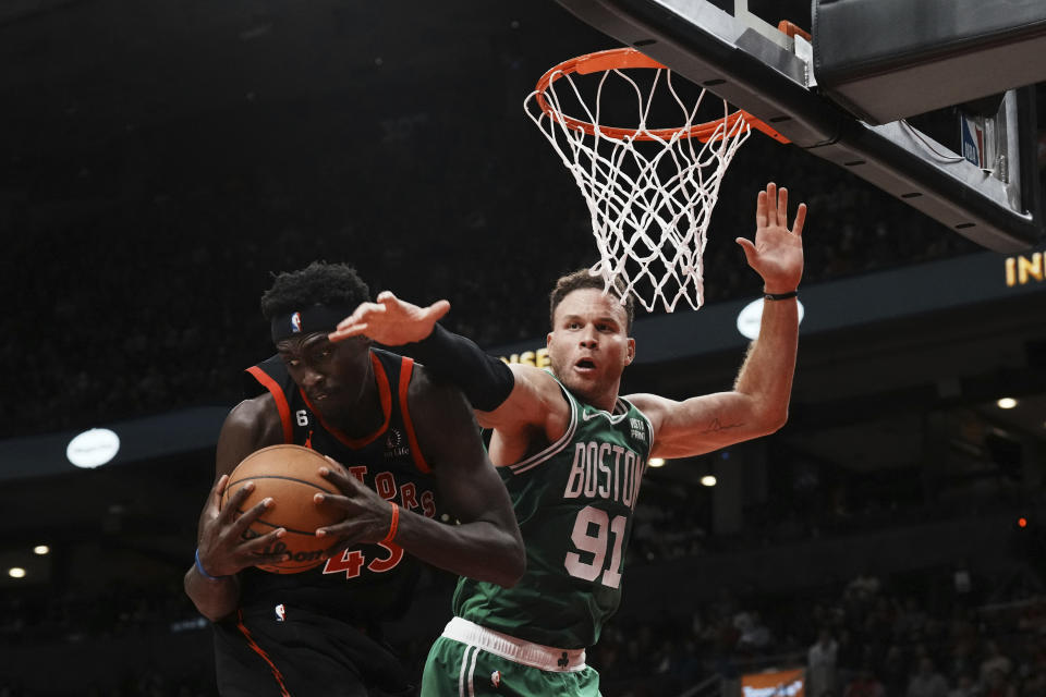 Boston Celtics forward Blake Griffin (91) tries to keep Toronto Raptors forward Pascal Siakam (43) from the rebound during the second half of an NBA basketball game in Toronto, Monday, Dec. 5, 2022. (Chris Young/The Canadian Press via AP)