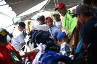 Central American migrants, moving in a caravan through Mexico, receive clothes at a temporary shelter, in Hermosillo, Sonora state, Mexico April 23, 2018. REUTERS/Edgard Garrido