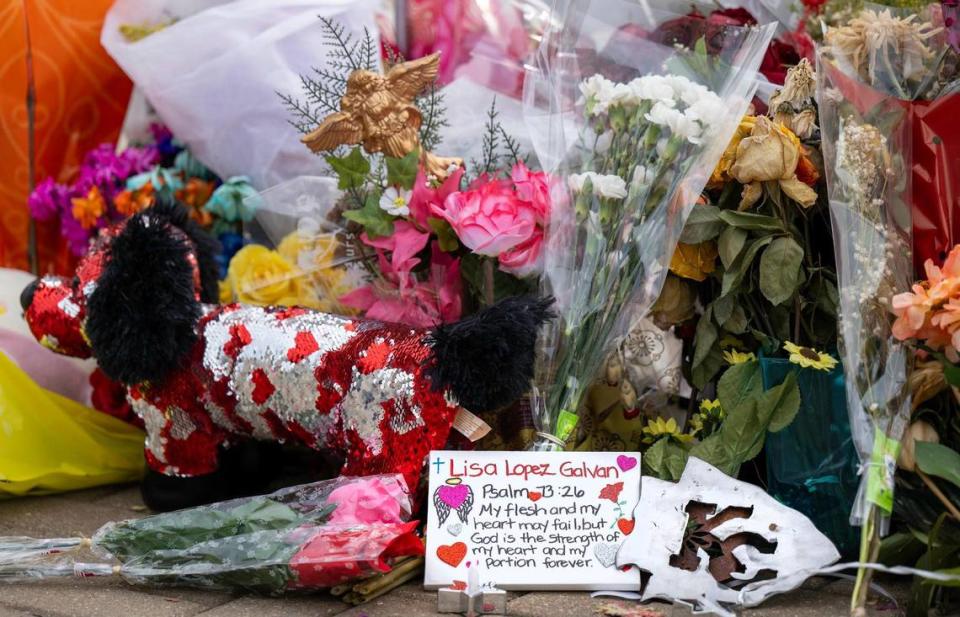 Flowers and other items have been left at a memorial for the victims of the Chiefs Super Bowl rally shooting, including for Lisa Lopez-Galvan, that is in the parking lot of Union Station on Wednesday, Feb. 21, 2024, in Kansas City.
