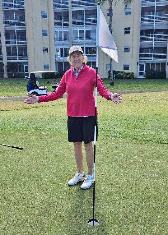 Mary Gale stands on the 14th green after carding her second hole in one of her round at Poinciana CC in Lake Worth, Florida.