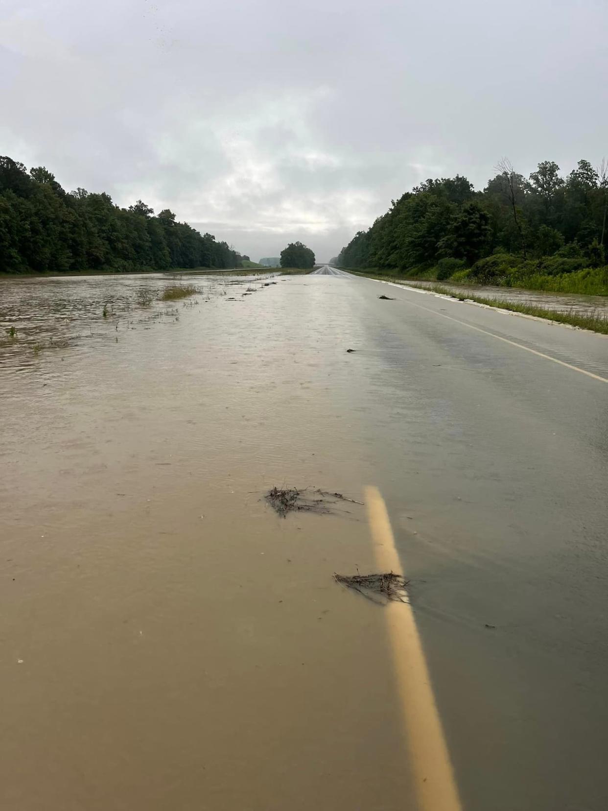 Ontario Provincial Police closed Highway 402, between exit 44 and exit 52, for more than 12 hours starting Wednesday evening due to flash flooding.  (Township of Warwick Fire & Rescue Department - image credit)