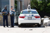 <p>State troopers look over the scene where a cab jumped a curb striking several bystanders near the Logan International Airport taxi pool in Boston, MA, July 3, 2017. (Keith Bedford/The Boston Globe via Getty Images) </p>