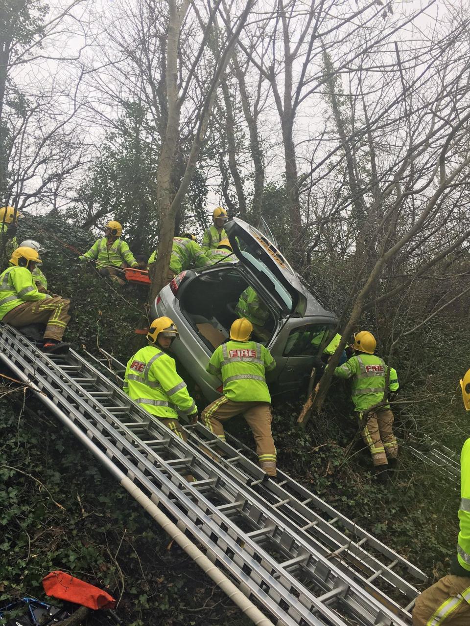 The couple, aged in their 80s, were trapped when their vehicle went off the road and up an embankment in Weston-super-Mare (Avon Fire and Rescue Service/PA)