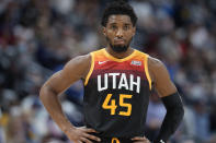 Utah Jazz guard Donovan Mitchell looks on during a timeout against the Denver Nuggets in the first half of an NBA basketball game, Sunday Jan. 16, 2022, in Denver. (AP Photo/David Zalubowski)