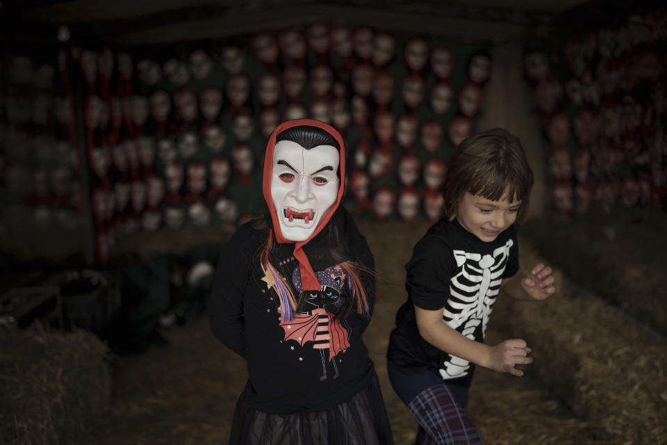 Children play at the West Side Hallo Fest, a Halloween festival in Bucharest, Romania, Friday, Oct. 27, 2023. Tens of thousands streamed last weekend to Bucharest's Angels' Island peninsula for what was the biggest Halloween festival in the Eastern European nation since the fall of Communism. (AP Photo/Vadim Ghirda)