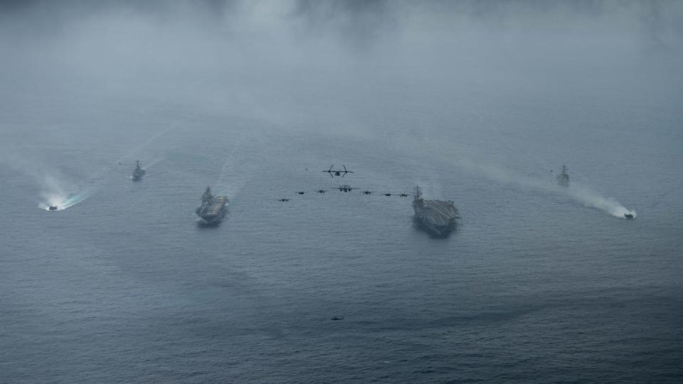 Ships and aircraft from the Nimitz Carrier Strike Group and the Makin Island Amphibious Ready Group operate in formation in the South China Sea on Feb. 15, 2023. (MC3  Kenneth Lagadi/U.S. Navy)