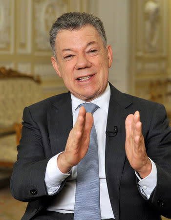 Colombia's outgoing President Juan Manuel Santos speaks with Reuters at the presidential palace, in Bogota, Colombia July 30, 2018. Picture taken July 30, 2018. REUTERS/Carlos Julio Martinez