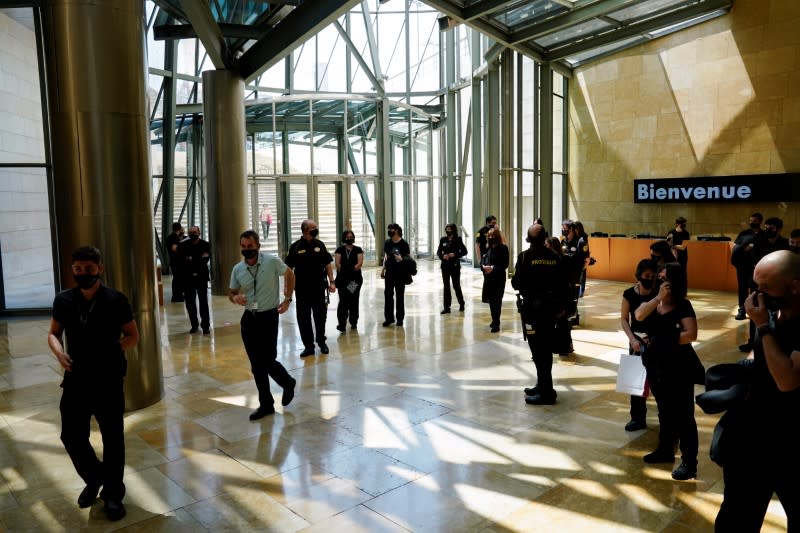 Security guards enter the Guggenheim Museum on the day it reopens its doors following a three-month closure, amid the coronavirus disease (COVID-19) outbreak, in Bilbao