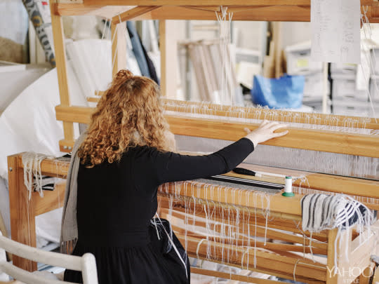 An assistant uses the loom in the Faustine Stienmetz studio