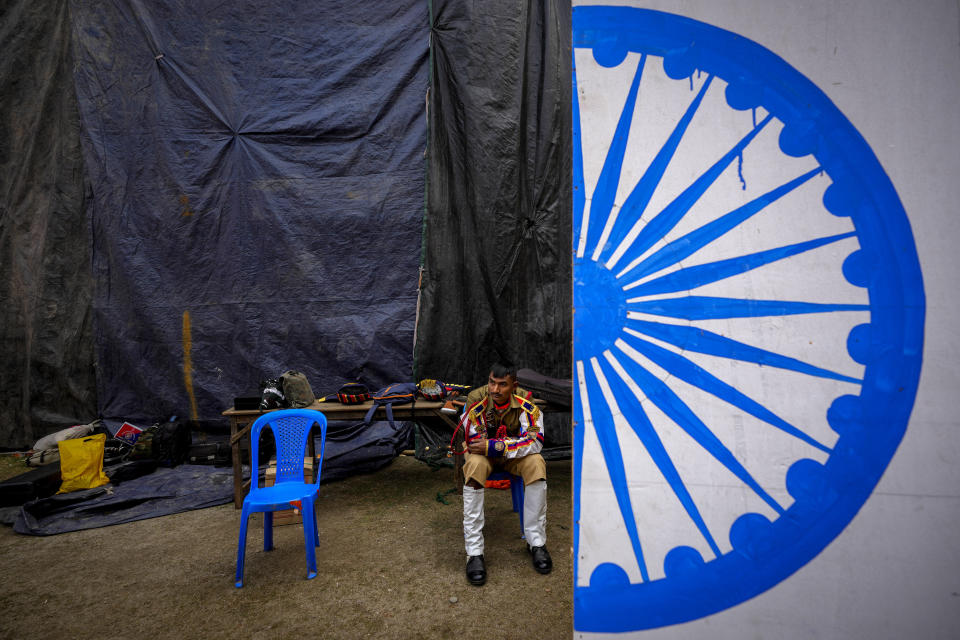 An Assam police personnel takes rest after the Republic Day parade in Guwahati, India, Friday, Jan. 26, 2024. (AP Photo/Anupam Nath)