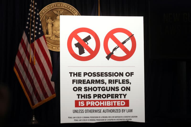 A sign similar to what is to be posted in a "gun free zone" is displayed prior to a news conference regarding new gun laws in New York