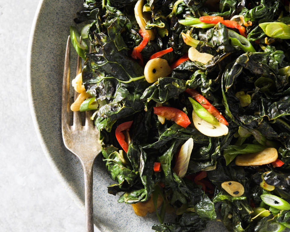 This image released by Milk Street shows a recipe for charred kale with garlic, chilies and lime. (Milk Street via AP)