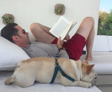 <p>“Summertime and the livin’ is easy … (for a few more days anyway),” <em>Wolverine</em> wrote, as he indulged in some R&R with a book and his pup. (Photo: <a rel="nofollow noopener" href="https://www.instagram.com/p/BYazmHmjvL4/?taken-by=thehughjackman" target="_blank" data-ylk="slk:Hugh Jackman via Instagram;elm:context_link;itc:0;sec:content-canvas" class="link ">Hugh Jackman via Instagram</a>) </p>