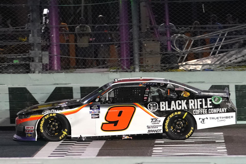 Noah Gragson (9) crosses the finish line to win the NASCAR Xfinity Series auto race at Homestead-Miami Speedway, Saturday, Oct. 22, 2022, in Homestead, Fla. (AP Photo/Lynne Sladky)